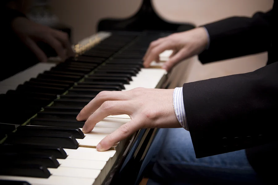 Man Playing Piano.webp